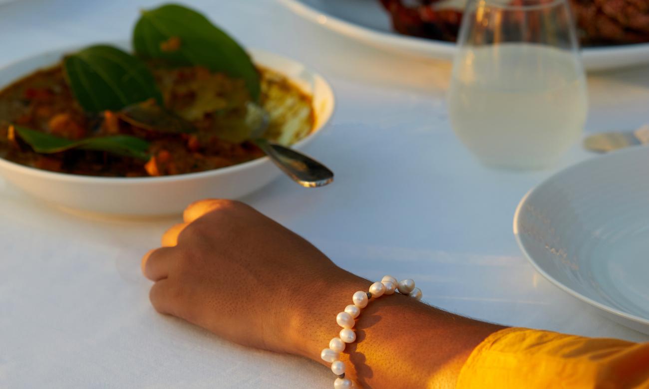 Hand resting on the table