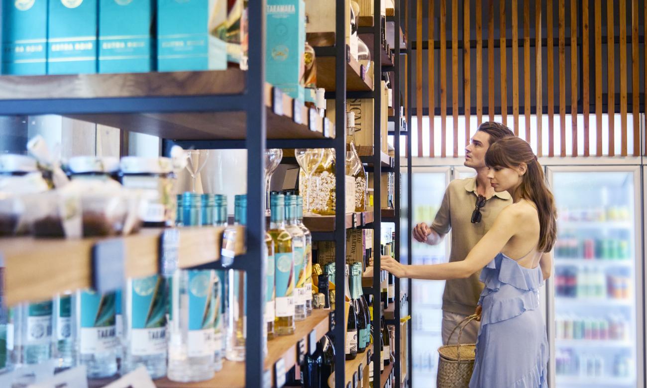 Couple browsing through wine selection