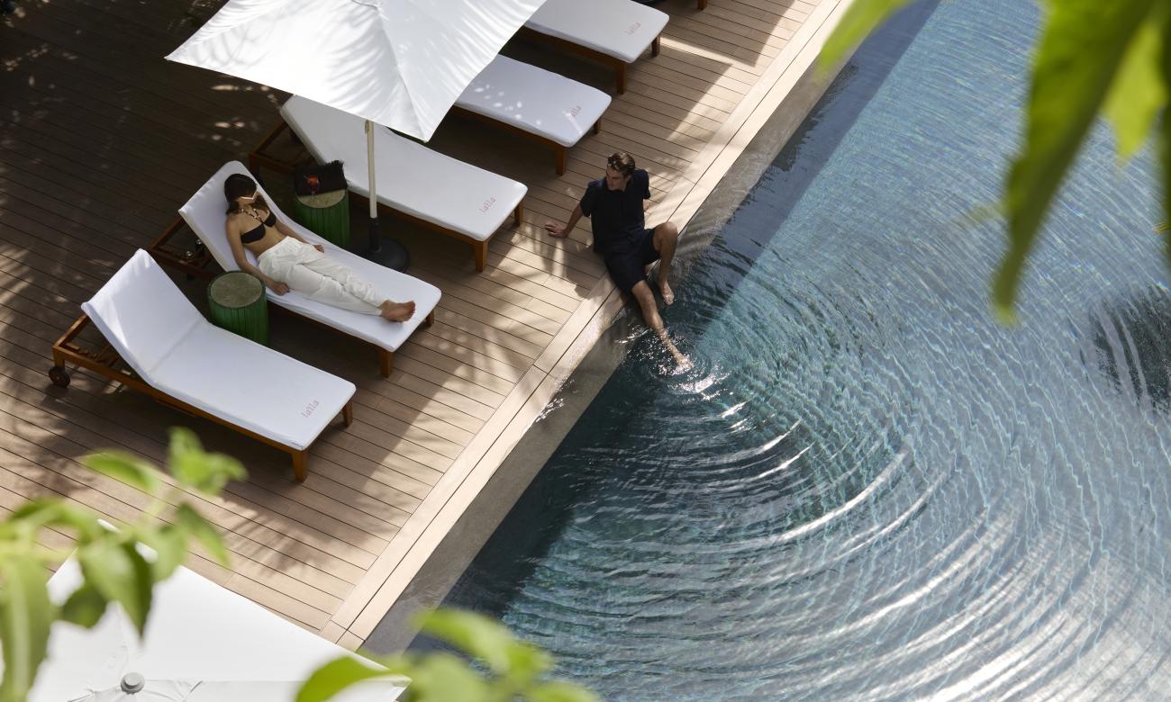 Couple by the side of the pool