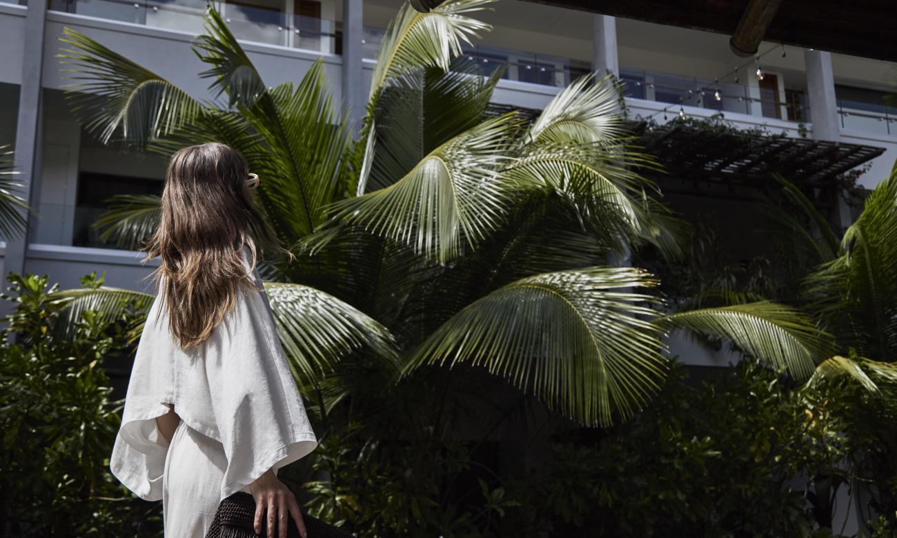 Woman looking up at the hotel